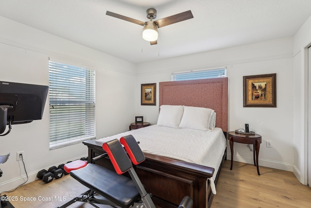 2702 Barrow Dr, Merritt Island, FL 32952 - bedroom with baseboards, ceiling fan, and light wood finished floors