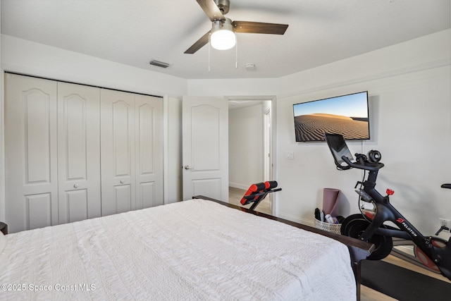 2702 Barrow Dr, Merritt Island, FL 32952 - bedroom with a closet, visible vents, baseboards, ceiling fan, and wood finished floors