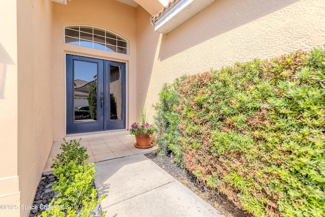 doorway to property with stucco siding