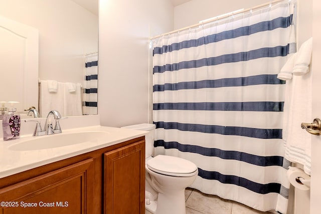 full bathroom featuring toilet, tile patterned floors, vanity, and a shower with shower curtain