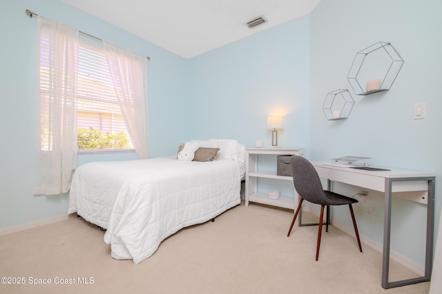 bedroom featuring baseboards, visible vents, and carpet