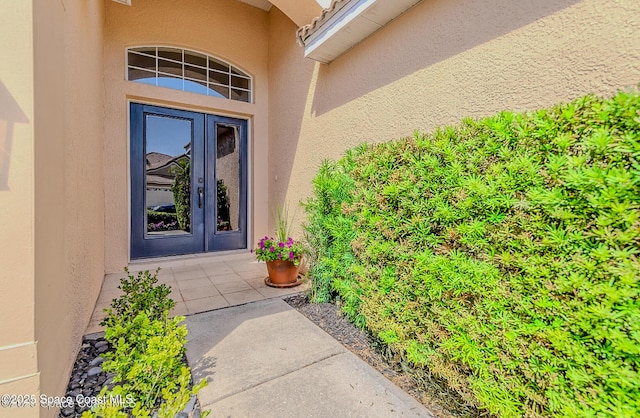 8064 Kingswood Way, Melbourne, FL 32940 - view of exterior entry with stucco siding