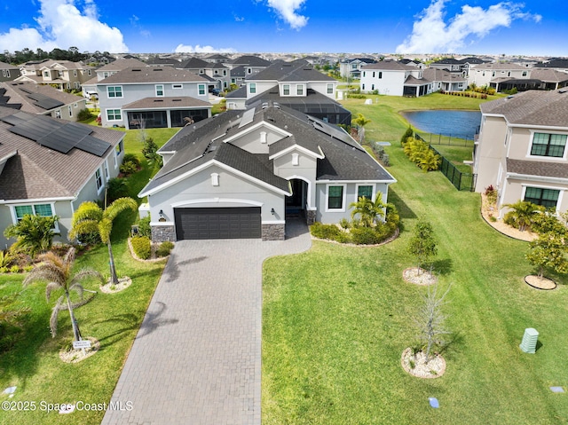 bird's eye view with a residential view and a water view