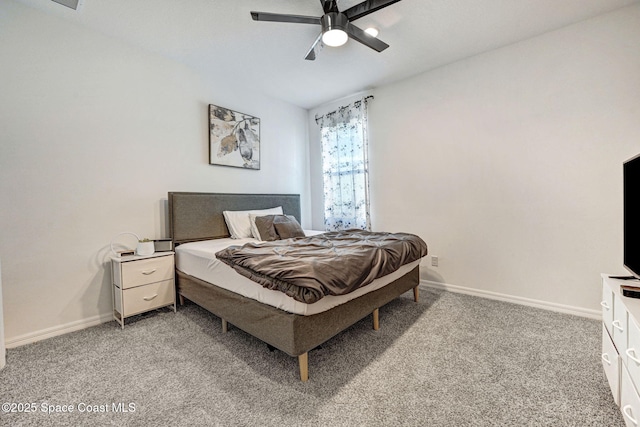 bedroom featuring light carpet, baseboards, and ceiling fan