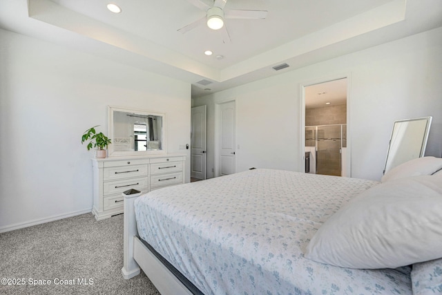 bedroom featuring visible vents, baseboards, recessed lighting, light carpet, and a raised ceiling