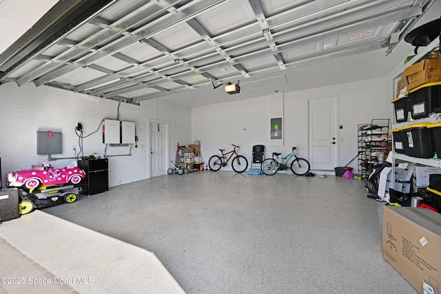 garage featuring a garage door opener and electric panel