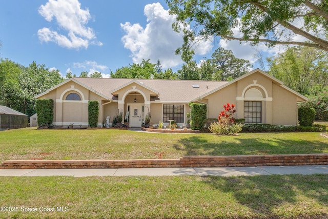 523 Hidden Hollow Dr, Merritt Island, FL 32952 - view of front of home with stucco siding and a front lawn