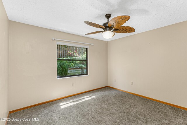 523 Hidden Hollow Dr, Merritt Island, FL 32952 - carpeted empty room featuring a textured ceiling, baseboards, and ceiling fan