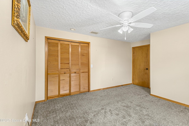 523 Hidden Hollow Dr, Merritt Island, FL 32952 - unfurnished bedroom featuring a closet, carpet, and baseboards