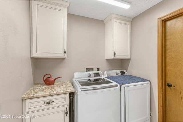 523 Hidden Hollow Dr, Merritt Island, FL 32952 - laundry area featuring washing machine and dryer, cabinet space, and a textured ceiling