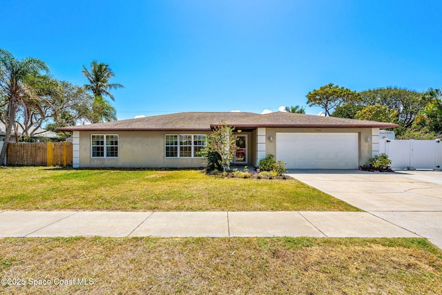 ranch-style house featuring a garage, stucco siding, and fence
