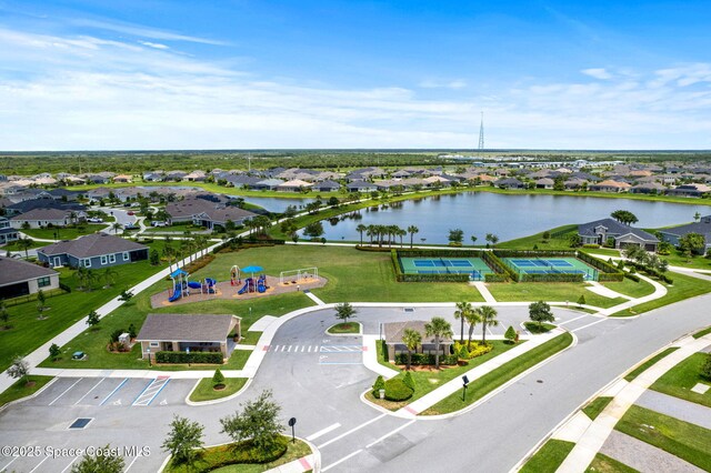 7785 Millbrook Ave, Melbourne, FL 32940 - aerial perspective of suburban area featuring a large body of water