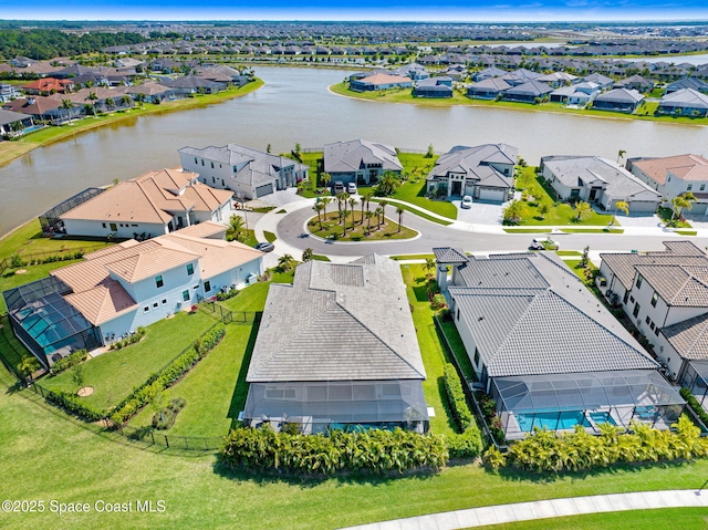 bird's eye view featuring a residential view and a water view