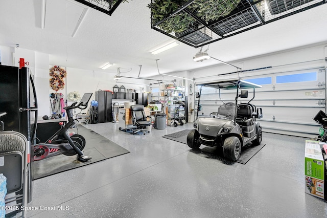 garage featuring freestanding refrigerator