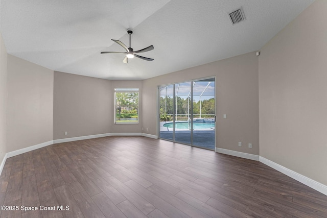 706 Palmer Way, Melbourne, FL 32940 - unfurnished room with ceiling fan, dark wood-style floors, and baseboards