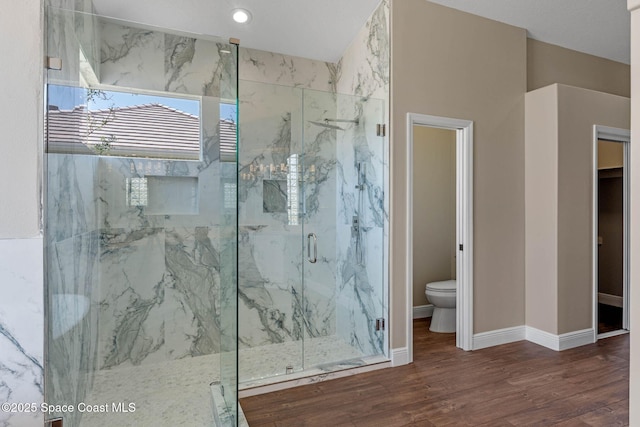 706 Palmer Way, Melbourne, FL 32940 - full bathroom featuring a marble finish shower, wood finished floors, baseboards, and toilet