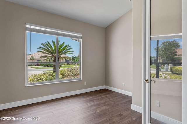 706 Palmer Way, Melbourne, FL 32940 - empty room featuring wood finished floors and baseboards