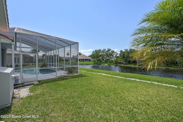 706 Palmer Way, Melbourne, FL 32940 - view of green lawn with a water view and an outdoor pool