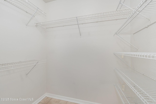 2728 Maderia Cir, Melbourne, FL 32935 - walk in closet featuring light tile patterned floors