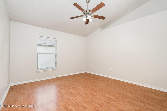 2728 Maderia Cir, Melbourne, FL 32935 - empty room featuring light wood finished floors, baseboards, a ceiling fan, and lofted ceiling