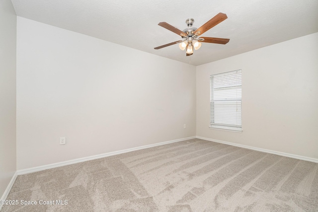 2728 Maderia Cir, Melbourne, FL 32935 - unfurnished room with carpet flooring, baseboards, and a ceiling fan