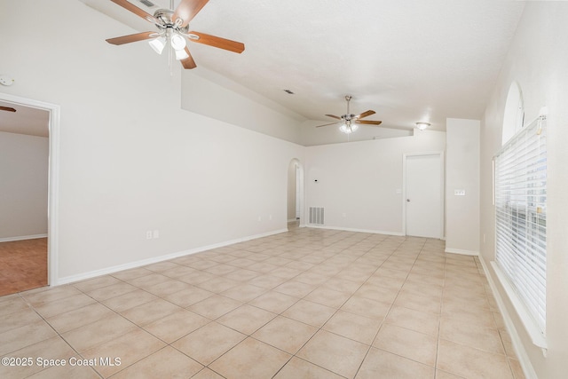 2728 Maderia Cir, Melbourne, FL 32935 - spare room with arched walkways, a ceiling fan, vaulted ceiling, visible vents, and baseboards