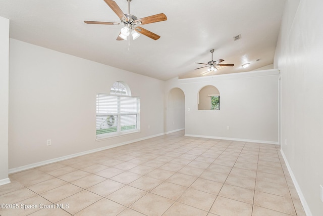 2728 Maderia Cir, Melbourne, FL 32935 - unfurnished room with arched walkways, a ceiling fan, visible vents, lofted ceiling, and baseboards