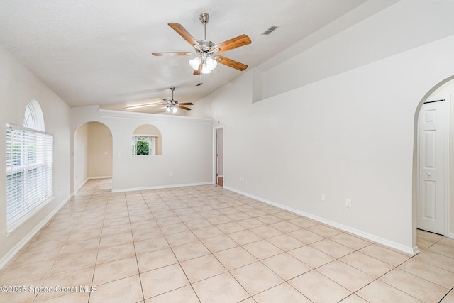 2728 Maderia Cir, Melbourne, FL 32935 - spare room with arched walkways, a ceiling fan, vaulted ceiling, visible vents, and baseboards