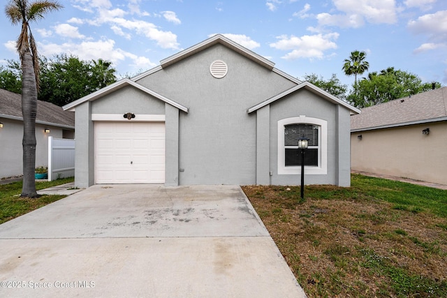 2728 Maderia Cir, Melbourne, FL 32935 - single story home with driveway, stucco siding, fence, and a garage