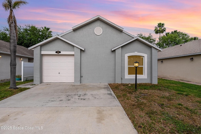 2728 Maderia Cir, Melbourne, FL 32935 - ranch-style house with concrete driveway, stucco siding, fence, and an attached garage