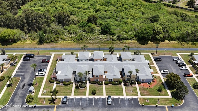 1480 Malibu Cir NE Unit 111, Palm Bay, FL 32905 - bird's eye view with a forest view