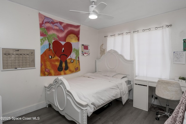 bedroom featuring ceiling fan and dark wood-type flooring