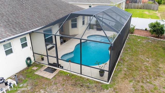 2748 Emerson Dr SE, Palm Bay, FL 32909 - view of pool featuring glass enclosure, a yard, a patio, a fenced backyard, and a fenced in pool
