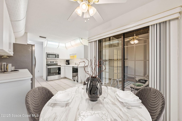 787 Greenwood Manor Cir Unit 14, West Melbourne, FL 32904 - dining room featuring a ceiling fan, visible vents, and light tile patterned flooring