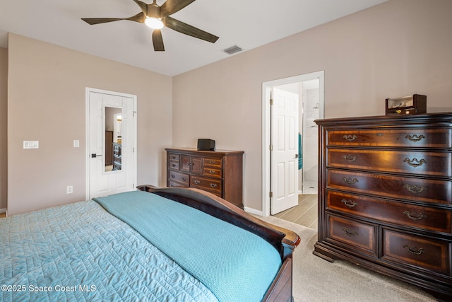 3666 Mount Carmel Ln, Melbourne, FL 32901 - bedroom with light colored carpet, connected bathroom, a ceiling fan, and baseboards