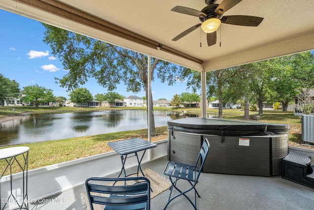3666 Mount Carmel Ln, Melbourne, FL 32901 - view of patio with a hot tub, a water view, a ceiling fan, and cooling unit