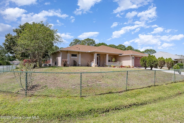 2298 Mantilla Ave SE, Palm Bay, FL 32909 - single story home featuring stucco siding, a garage, and a fenced front yard