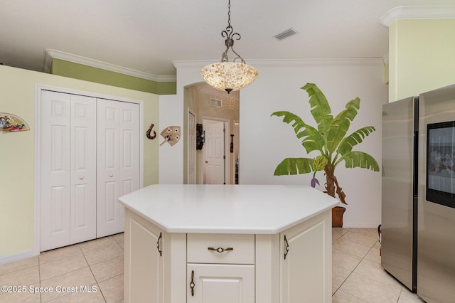 2298 Mantilla Ave SE, Palm Bay, FL 32909 - kitchen featuring a kitchen island, light countertops, visible vents, and crown molding