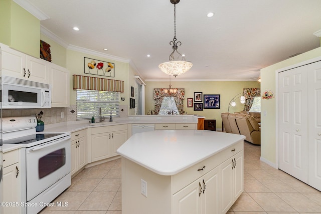 2298 Mantilla Ave SE, Palm Bay, FL 32909 - kitchen with crown molding, light countertops, a sink, a kitchen island, and white appliances