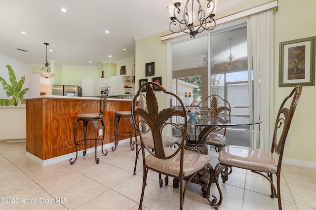 2298 Mantilla Ave SE, Palm Bay, FL 32909 - dining space with crown molding, light tile patterned floors, baseboards, recessed lighting, and an inviting chandelier