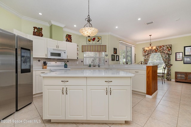 2298 Mantilla Ave SE, Palm Bay, FL 32909 - kitchen featuring light countertops, an inviting chandelier, electric range oven, smart refrigerator, and white microwave