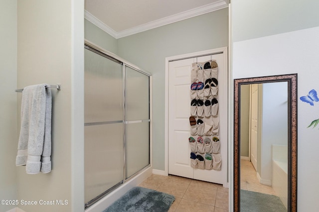 2298 Mantilla Ave SE, Palm Bay, FL 32909 - full bath with tile patterned floors, a washtub, ornamental molding, and a shower stall
