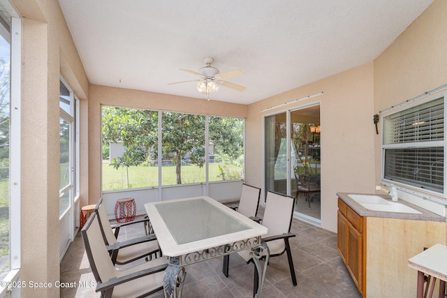 2298 Mantilla Ave SE, Palm Bay, FL 32909 - sunroom / solarium featuring outdoor dining space, ceiling fan, and a sink