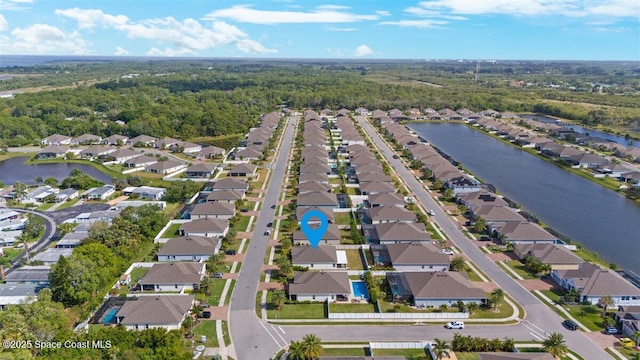 aerial view with a water view and a residential view