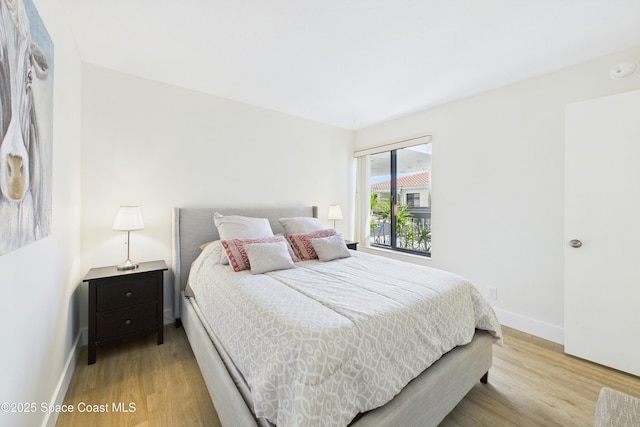 6365 Bahia Del Mar Blvd S Unit 210, Saint Petersburg, FL 33710 - bedroom with light wood finished floors and baseboards