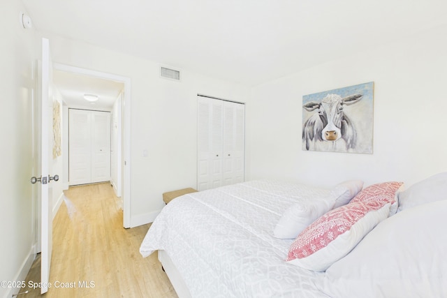 6365 Bahia Del Mar Blvd S Unit 210, Saint Petersburg, FL 33710 - bedroom with light wood-type flooring, baseboards, a closet, and visible vents