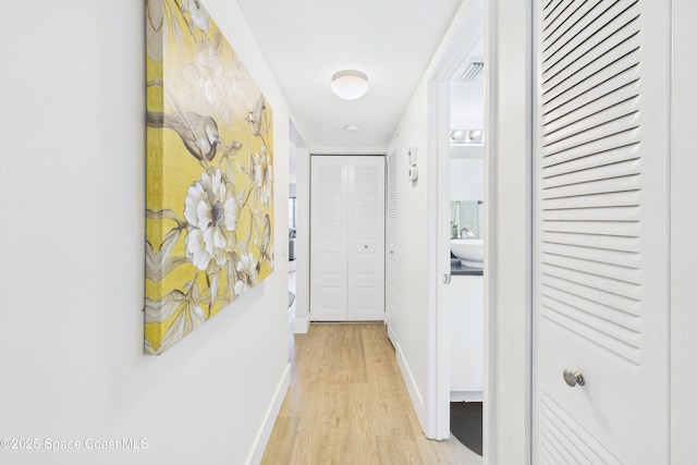 6365 Bahia Del Mar Blvd S Unit 210, Saint Petersburg, FL 33710 - hall with baseboards and light wood-type flooring