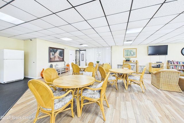 6365 Bahia Del Mar Blvd S Unit 210, Saint Petersburg, FL 33710 - dining space featuring baseboards, visible vents, a drop ceiling, and light wood finished floors