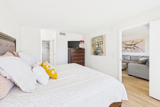 6365 Bahia Del Mar Blvd S Unit 210, Saint Petersburg, FL 33710 - bedroom with visible vents and wood finished floors