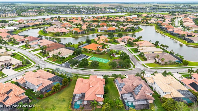 birds eye view of property featuring a water view and a residential view